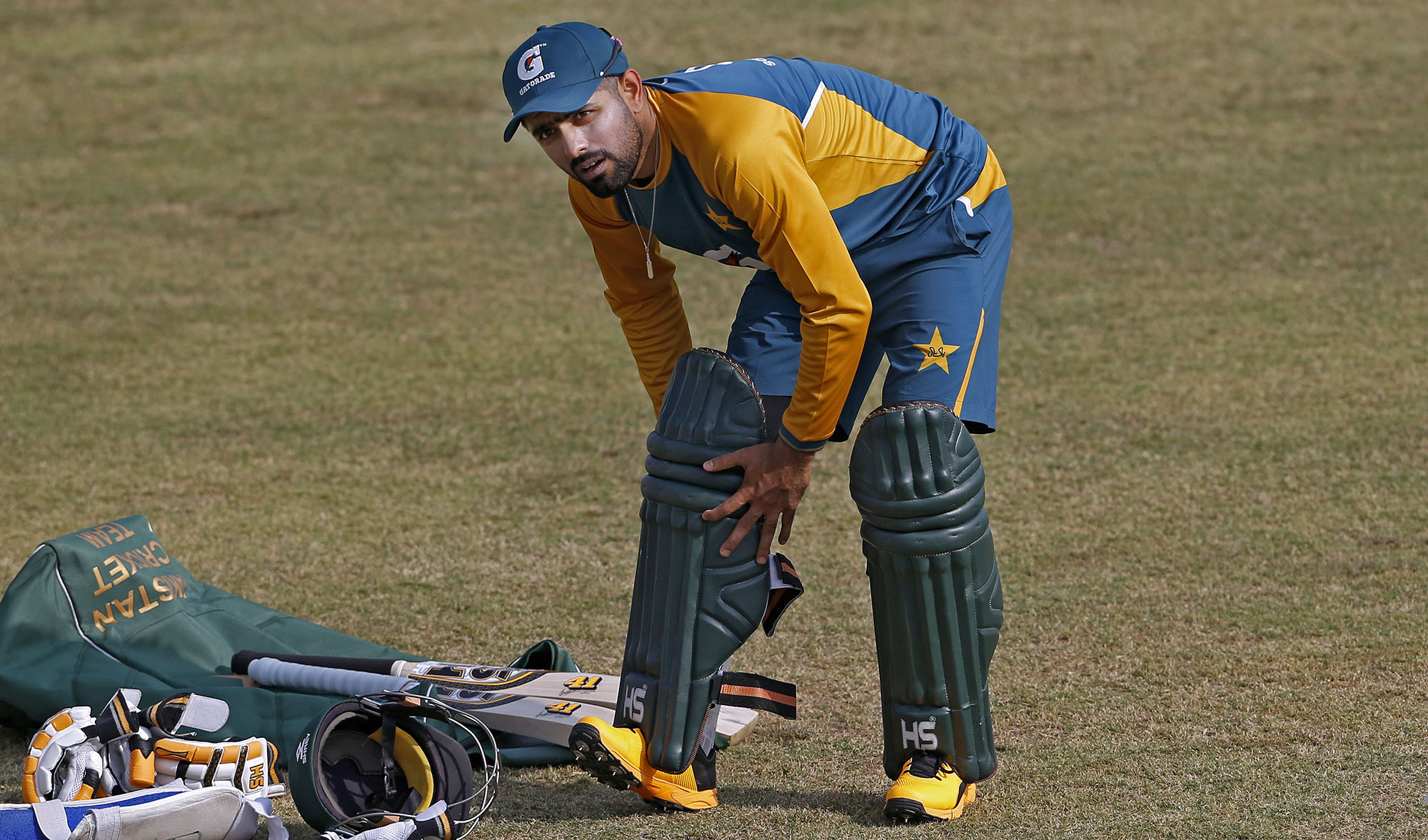 Pakistan cricket team skipper Babar Azam pads up during a practice session at the Pindi Cricket Stadium, in Rawalpindi on Oct. 29, 2020. (AP)