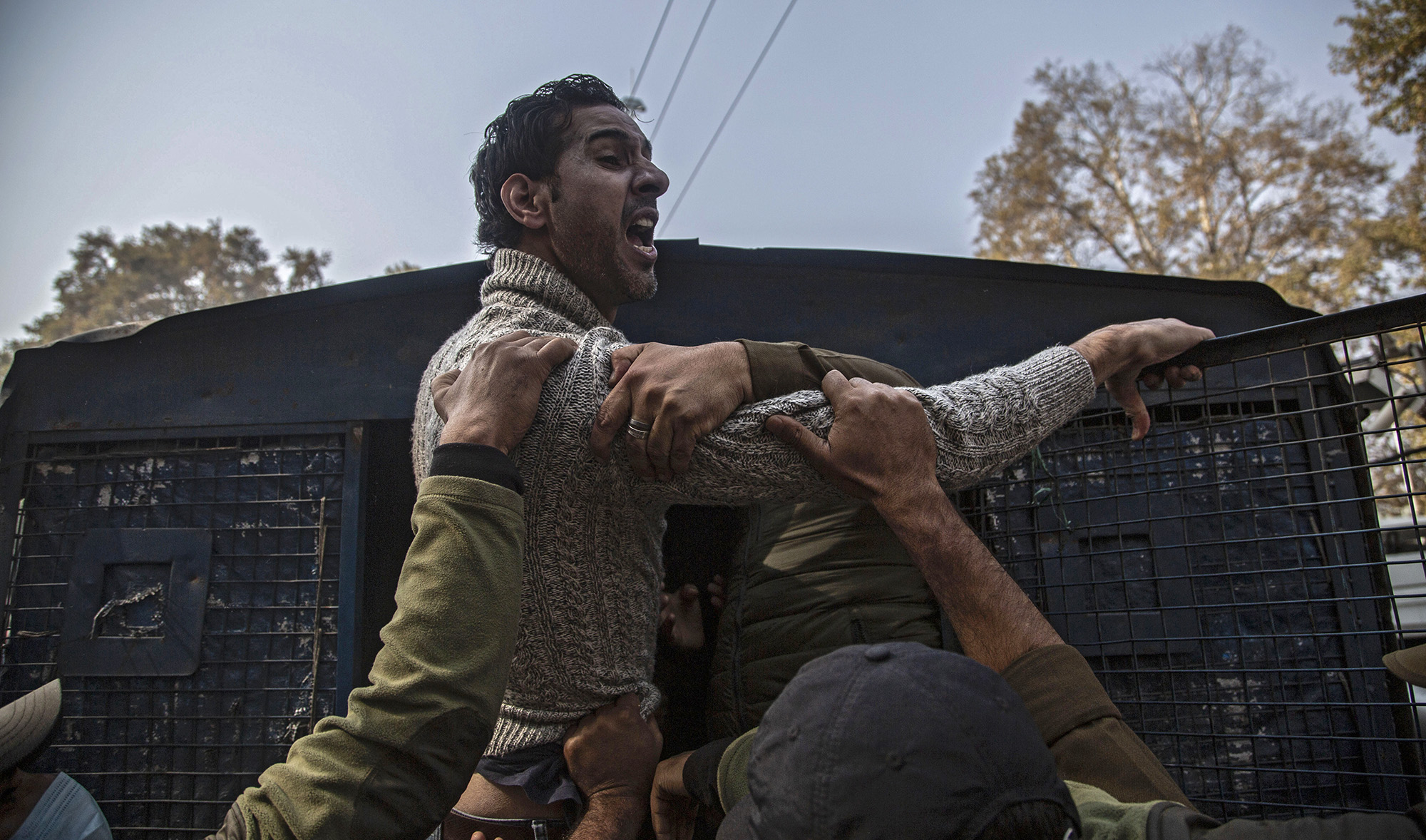 Indian police detain an activist of Peoples Democratic Party (PDP) protesting against India's new land laws that allows any Indian citizen to buy land in the disputed region in Srinagar, Indian-administered Kashmir on Oct. 29, 2020. (AP)