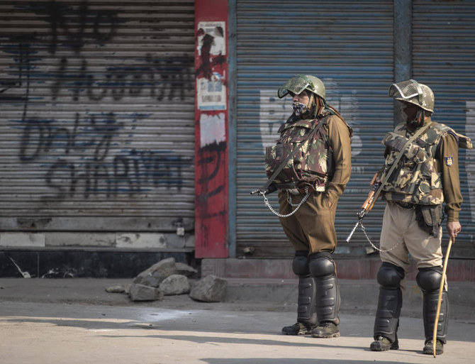 Indian paramilitary soldiers stand guard at a closed market area during a strike called by separatists in Srinagar, Indian controlled Kashmir, Saturday, Oct. 31, 2020. (AP)