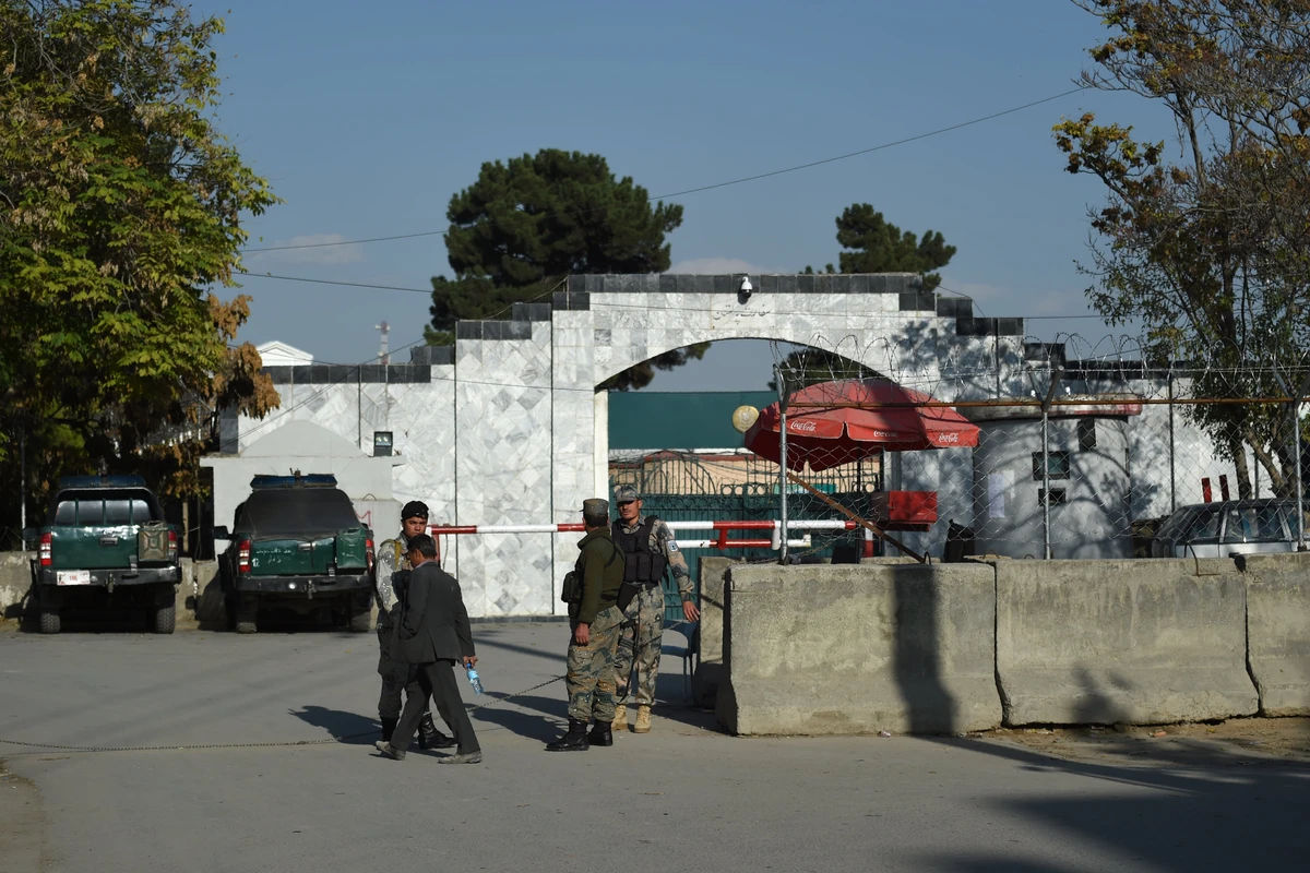 Afghan police personnel stand guard outside Pakistan's embassy, in Kabul on November 4, 2019. Hundreds of Afghans -- many needing urgent medical treatment -- gathered near the Pakistani embassy in Kabul on November 4, waiting for word of when the visa section might re-open. (AFP)