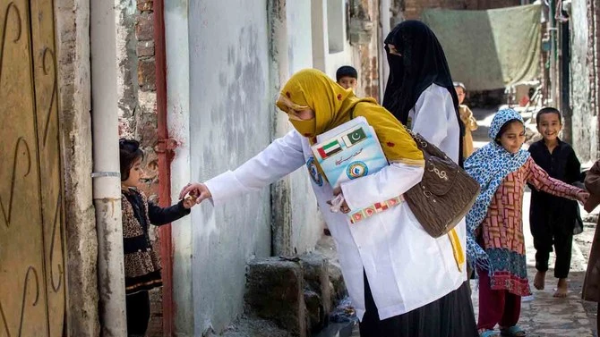 A female health worker is taking part in a door-to-door vaccination campaign by the UAE-Pakistan Assistance Program. (WAM)