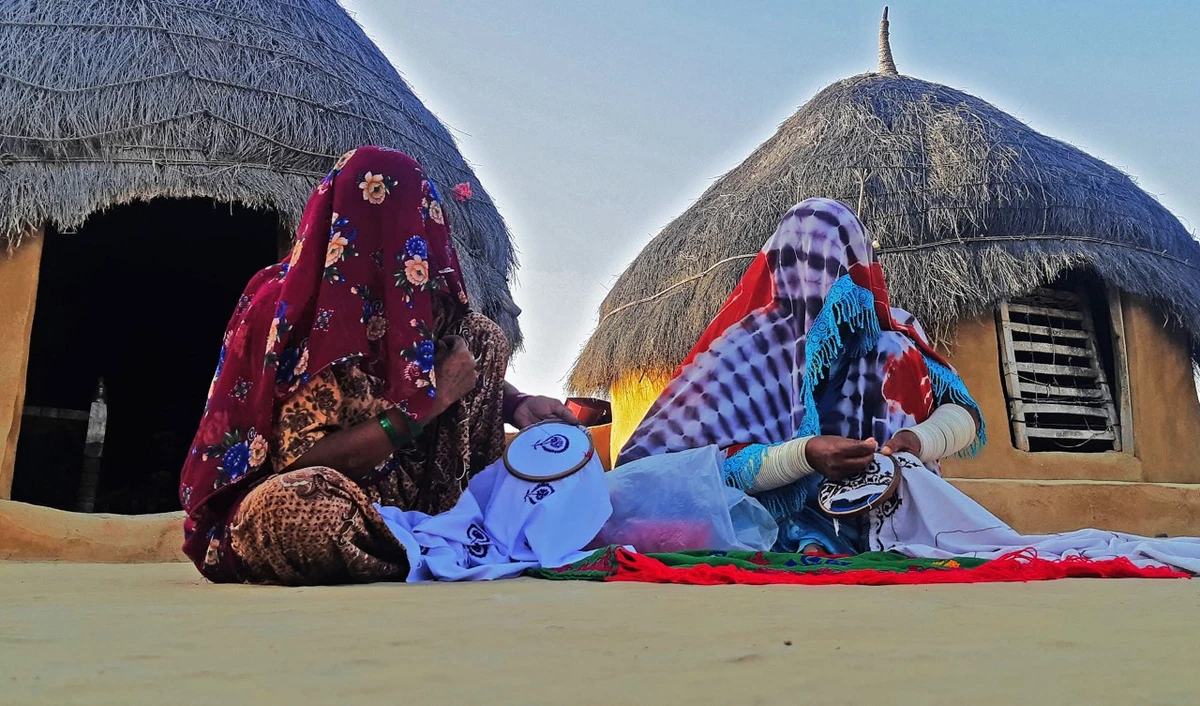 Craftswomen stitch embroidery work in Khooh Kapni village in Achro Thar desert near Khipro, Sanghar district, Sindh province, Pakistan, on October 26, 2020. (AN photo by Zulfiqar Kunbhar)
