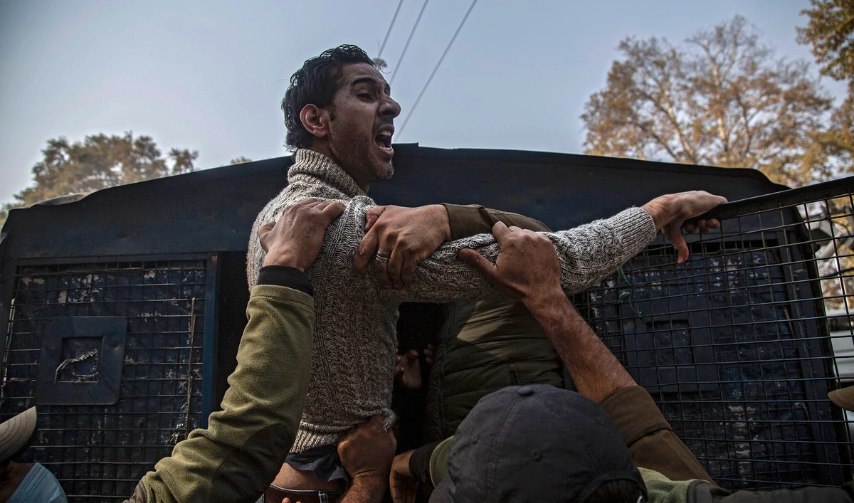 Indian police detain an activist of Peoples Democratic Party (PDP) protesting against India's new land laws that allows any Indian citizen to buy land in the disputed region in Srinagar, Indian-administered Kashmir on Oct. 29, 2020. (AP)