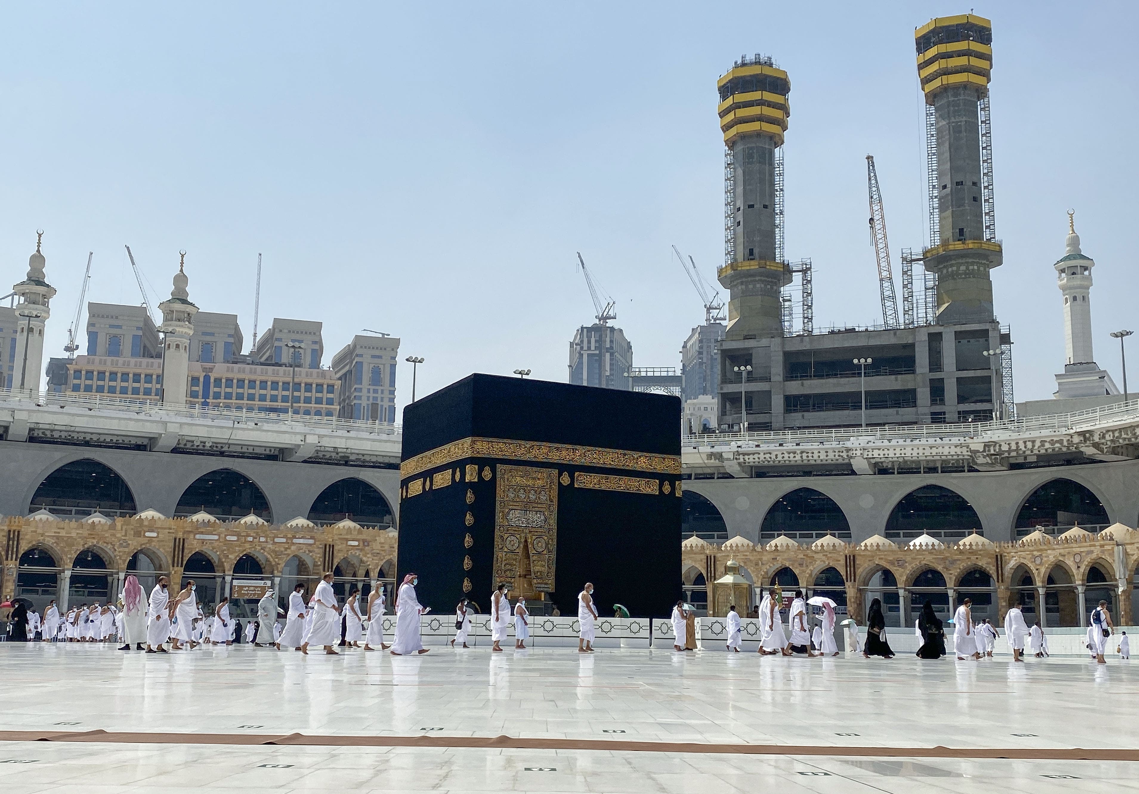 Saudis and foreign residents circumambulate (Tawaf) the Kaaba in the Grand Mosque complex in the holy city of Mecca, on October 4, 2020, as authorities partially resume the year-round Umrah for a limited number of pilgrims amid extensive health precautions after a seven-month coronavirus hiatus. (AFP)