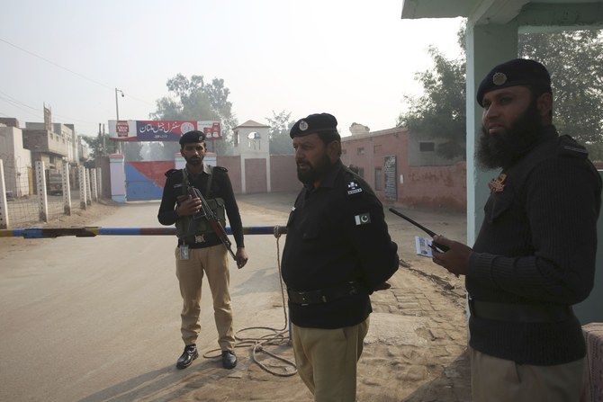 Pakistani police officers stand guard outside Multan jail after a court’s decision for a professor facing blasphemy case, in Multan, Pakistan, Saturday, Dec. 21, 2019. (AP)