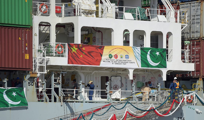 In this photograph taken on Nov. 13, 2016, Pakistani Naval personnel stand guard near a ship carrying containers at the Gwadar port, some 700 kms west of Karachi, during the opening ceremony of a pilot trade program between Pakistan and China. (AFP/File)