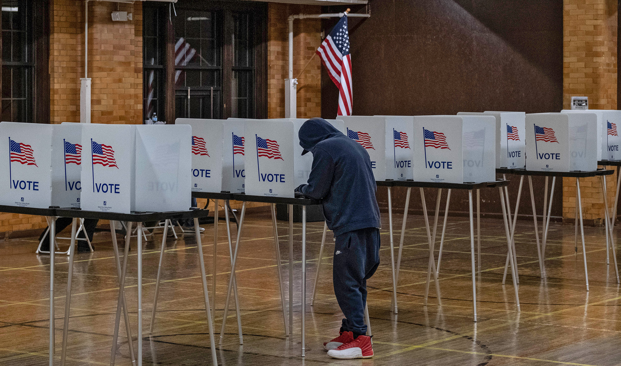 A resident casts his vote on Nov. 3, 2020, at Berston Fieldhouse in Flint, Michigan, US. (AFP)