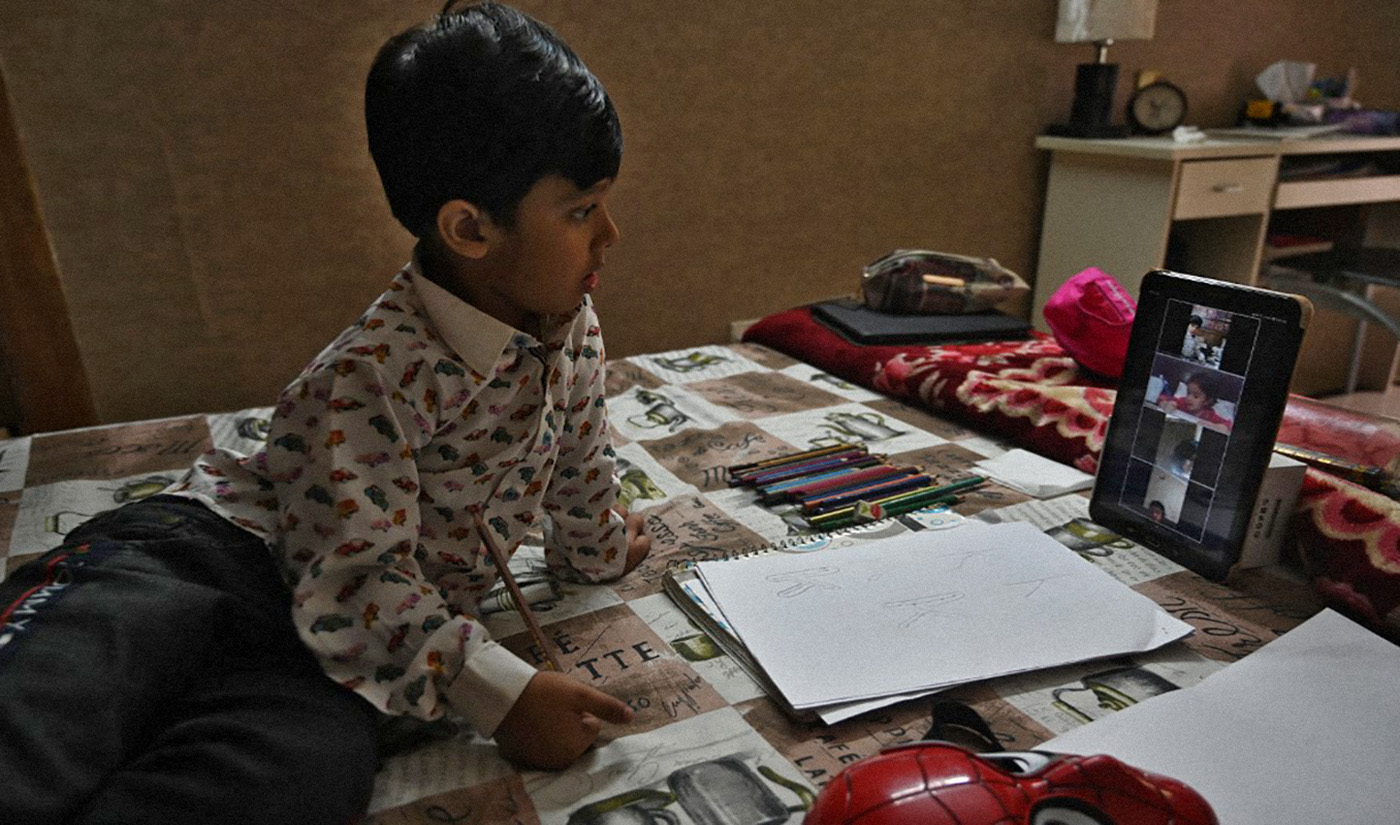 Student Mohammad Ibrahim, 5, attends an online class at his home, while schools are closed, during a government-imposed nationwide lockdown as a preventive measure against the COVID-19 coronavirus, in Islamabad on April 14, 2020. (AFP/File)