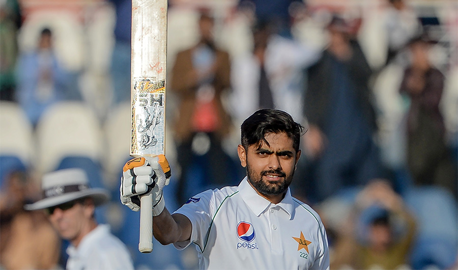Pakistan's Babar Azam celebrates after scoring a century (100 runs) during the second day of the first cricket Test match between Pakistan and Bangladesh at the Rawalpindi Cricket Stadium in Rawalpindi on February 8, 2020. (AFP)