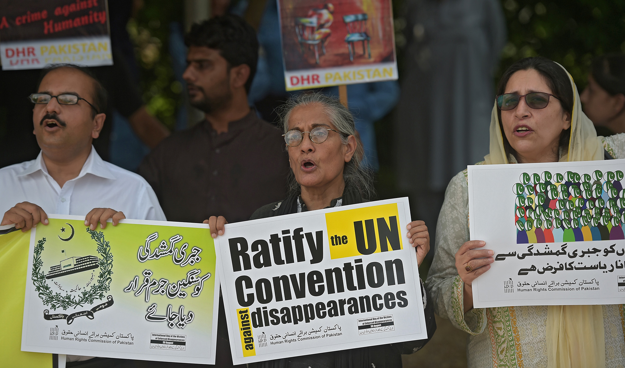 Pakistani human rights activists carry placards during a protest for missing persons to mark the International Day of the Victims of Enforced Disappearances in Islamabad on Aug. 30, 2016. (AFP/File)