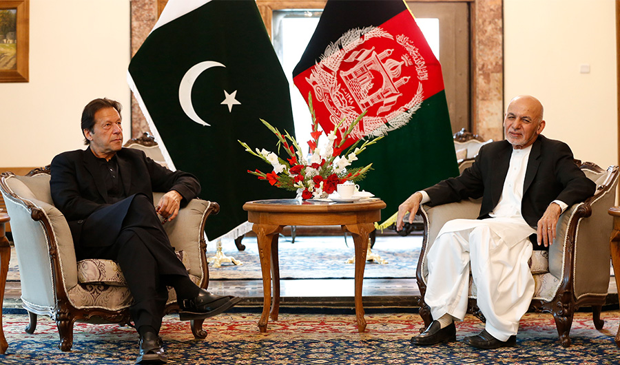 Pakistan's Prime Minister Imran Khan (L) and Afghan President Ashraf Ghani attend their meeting at the Presidential Palace in Kabul on November 19, 2020. (AFP)