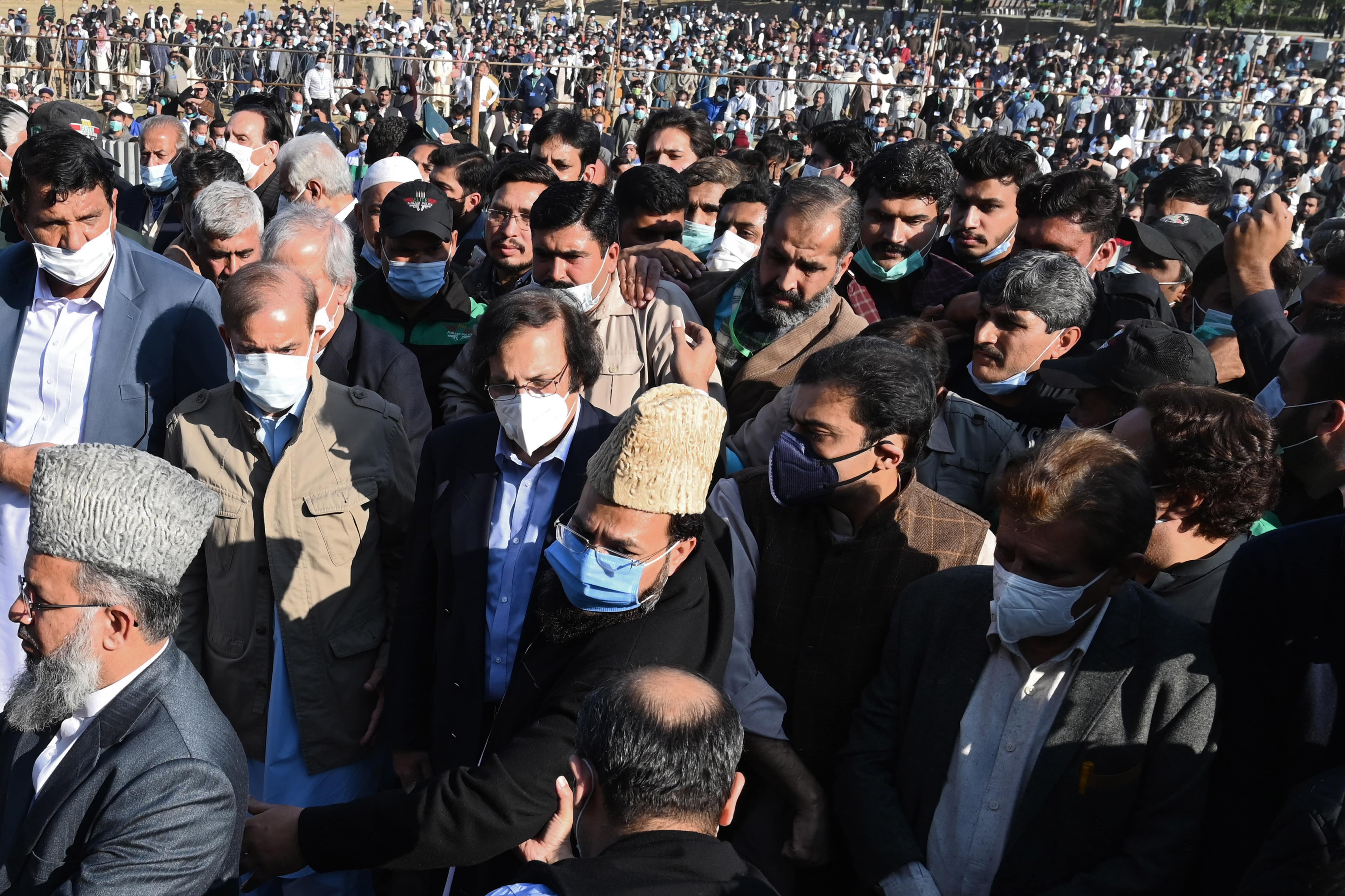 Opposition leader Shahbaz Sharif (2L), and brother of former Pakistan's prime minister Nawaz Sharif, arrives to attend the funeral of his late mother Begum Shamim Akhtar, in Lahore on November 28, 2020. (AFP)
