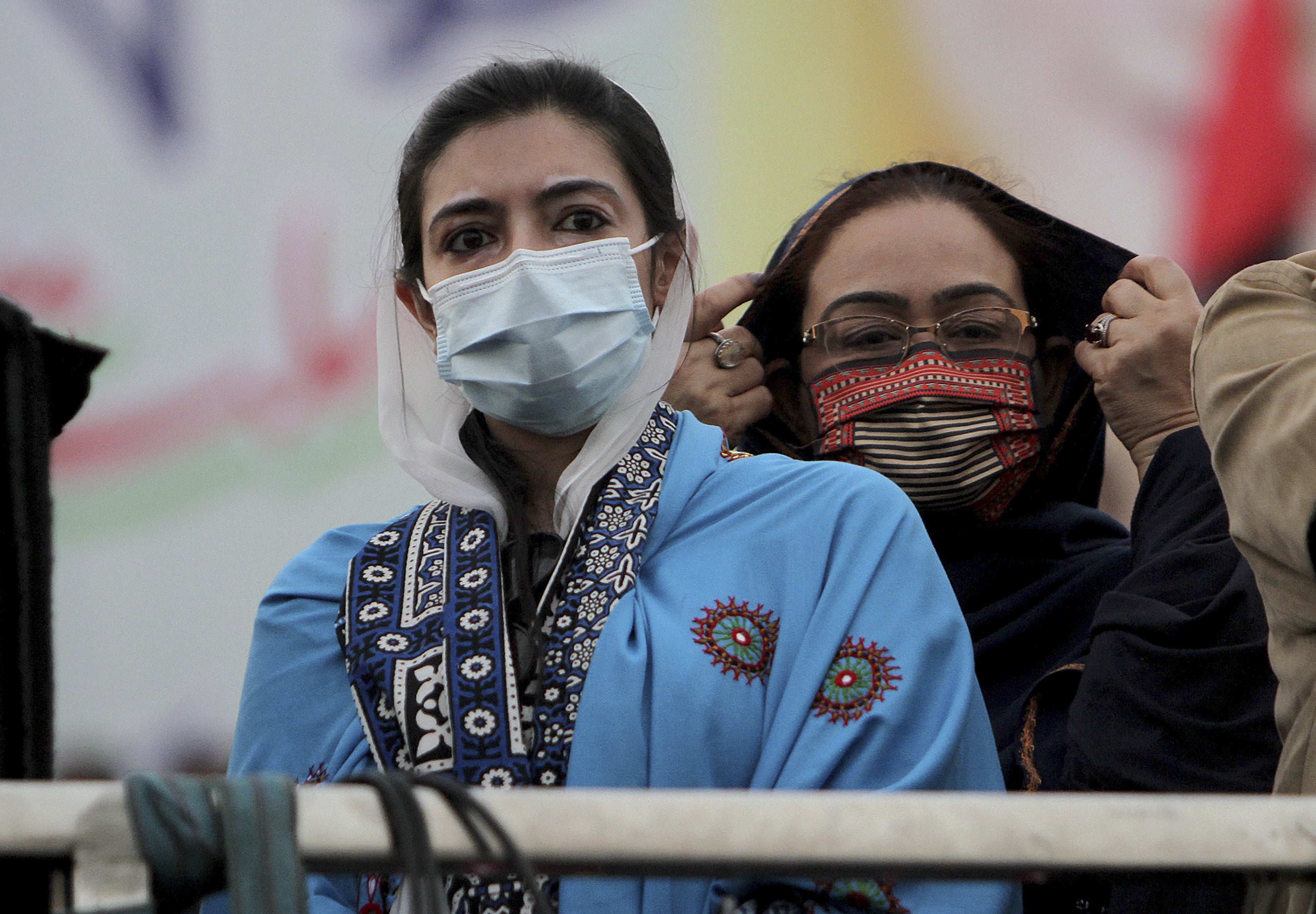 Asifa Bhutto Zardari, left, a leader of the Pakistan Democratic Movement, an alliance of opposition parties, attends an anti-government rally, in Multan, Pakistan, Monday, Nov. 30, 2020. (AFP)