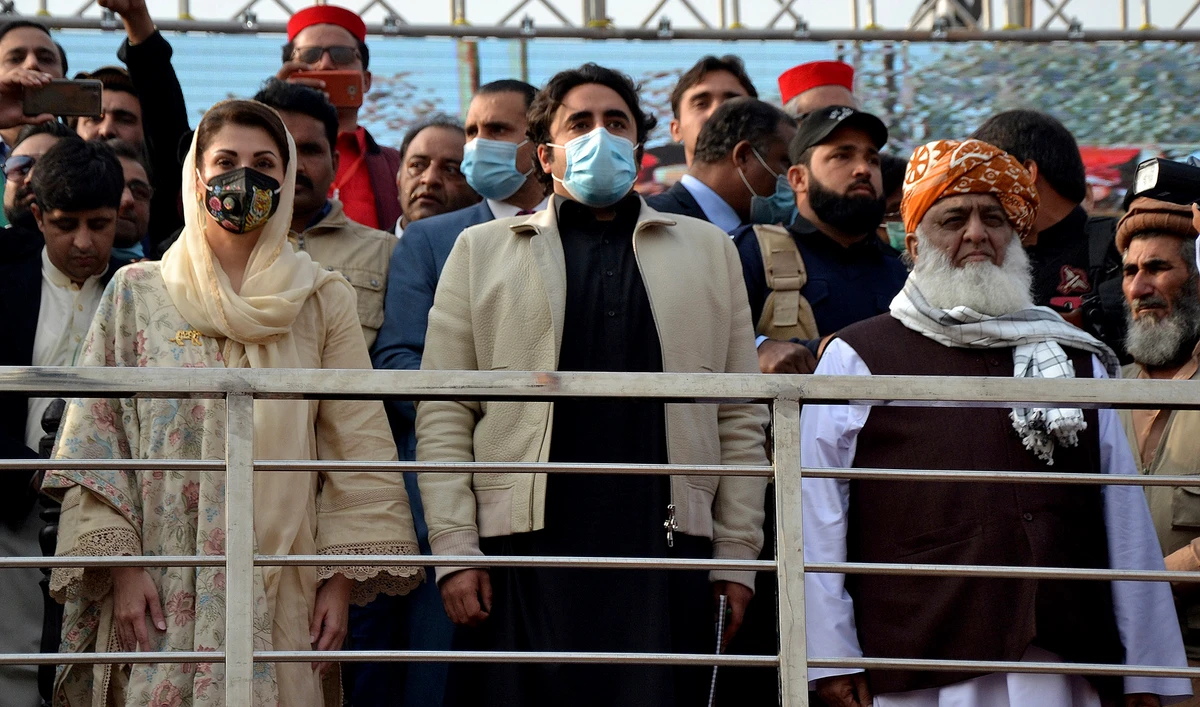 Maulana Fazal-ur-Rehman, right in front row, Bilawal Bhutto Zardari, center, Maryam Nawaz Sharif, left, leaders of the Pakistan Democratic Movement, an alliance of opposition parties, attend an anti-government rally in Peshawar on Nov. 22, 2020. (AFP)