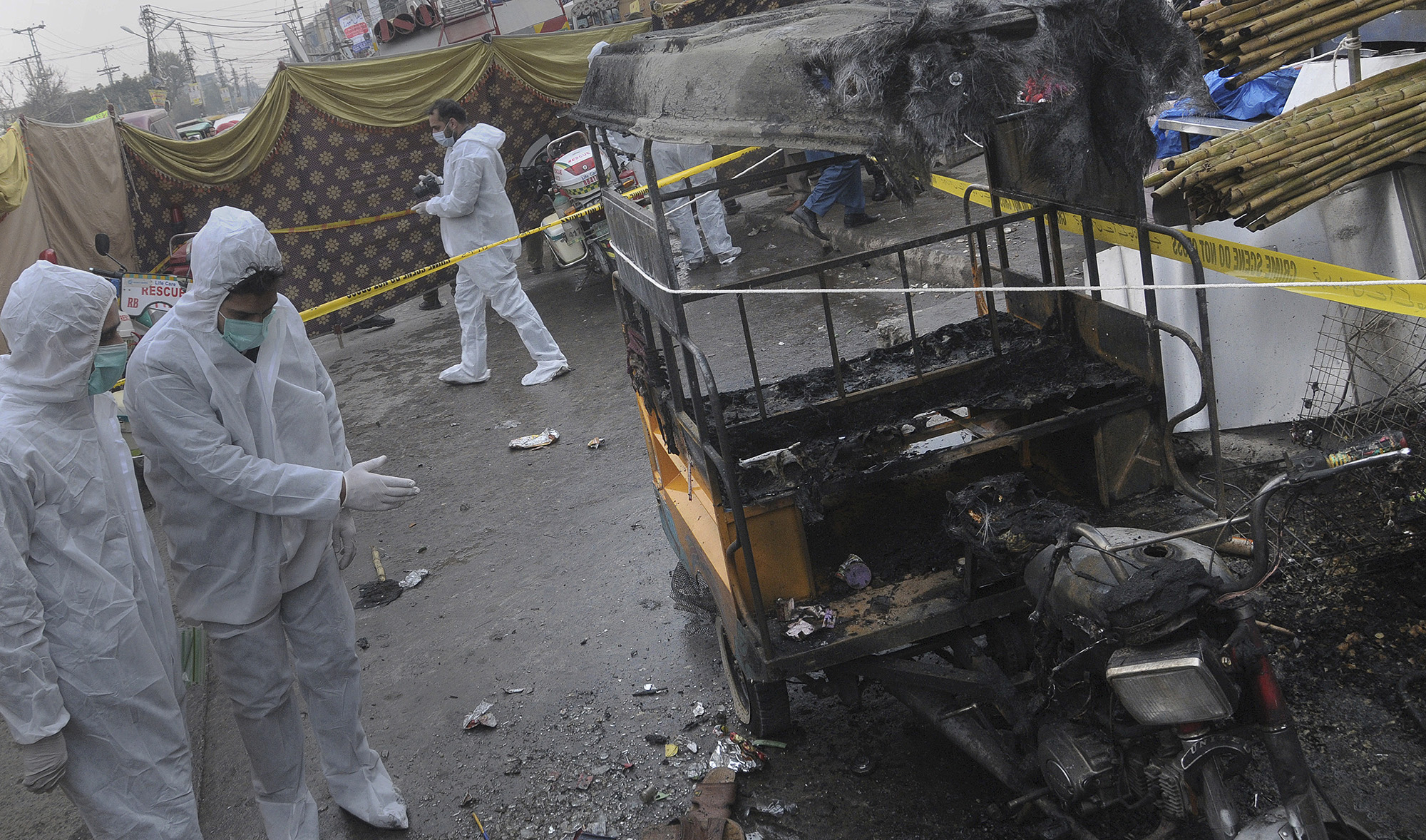 Pakistani investigators examine the site of bomb explosion in Rawalpindi on Dec. 4, 2020. (AP)