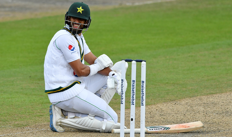 Pakistan's Shan Masood reacts after being hit on the arm by a ball from England's Stuart Broad during play on the second day of the first Test cricket match between England and Pakistan at Old Trafford in Manchester, north-west England on August 6, 2020. (AFP)
