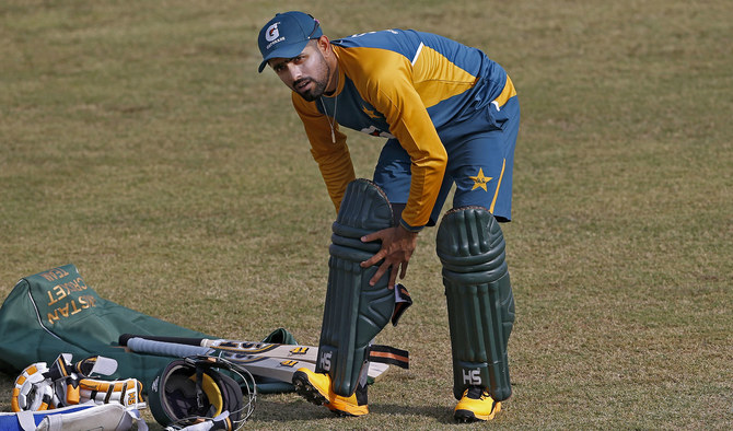 Pakistan cricket team skipper Babar Azam pads up during a practice session at the Pindi Cricket Stadium, in Rawalpindi on Oct. 29, 2020. (AP)