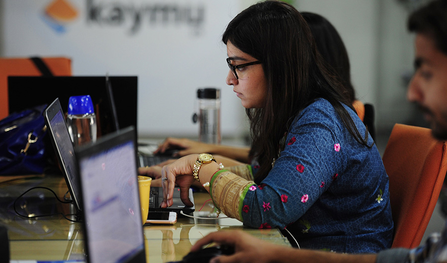 This photograph taken on November 19, 2015 shows Pakistani employees of online marketplace company Kaymu at work in Karachi.( AFP/ File photo)