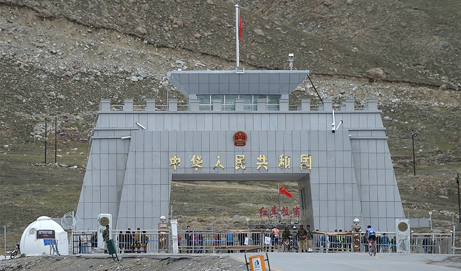 In this picture taken on June 30, 2019, a Pakistani cyclist (R) rides past the Pakistan-China Khunjerab Pass, the world's highest paved border. (AFP)