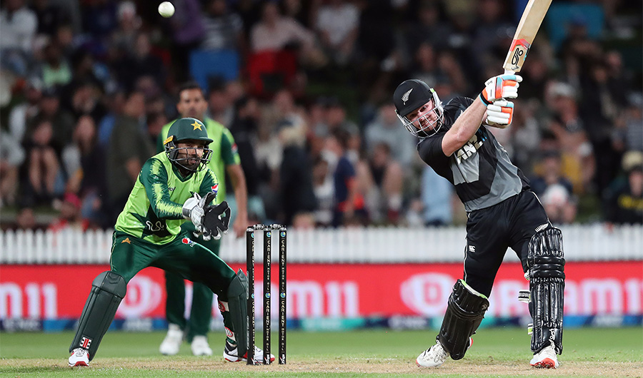 New Zealand’s Tim Seifert (R) plays a shot as Pakistan's wicketkeeper Mohammad Rizwan looks on during the second T20 international cricket match between New Zealand and Pakistan at Seddon Park in Hamilton on December 20, 2020. (AFP)