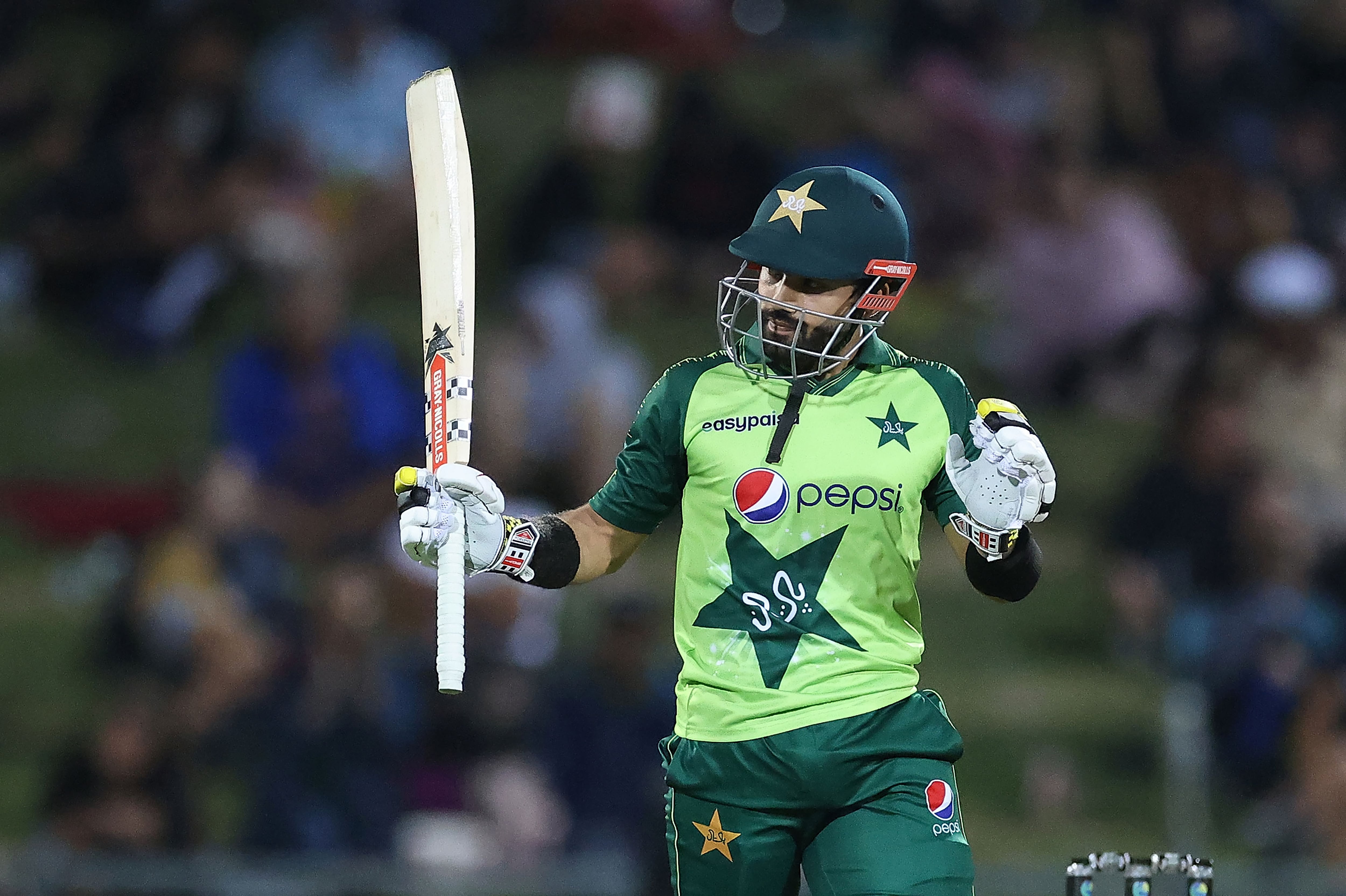 Pakistan batsman Mohammad Rizwan celebrates reaching his half century (50 runs) during the third T20 cricket match between New Zealand and Pakistan at McLean Park in Napier on December 22, 2020. (AFP)