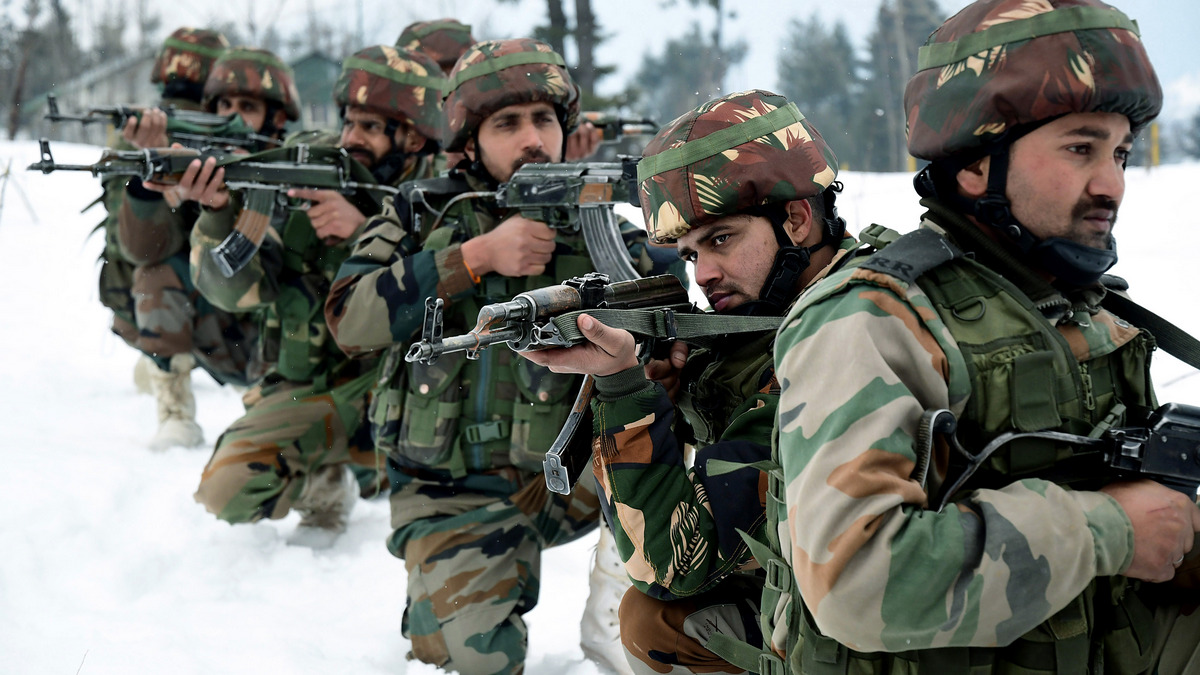 Indian soldiers patrol near the snow-covered disputed Jammu and Kashmir border in this undated file photo. (File Photo)