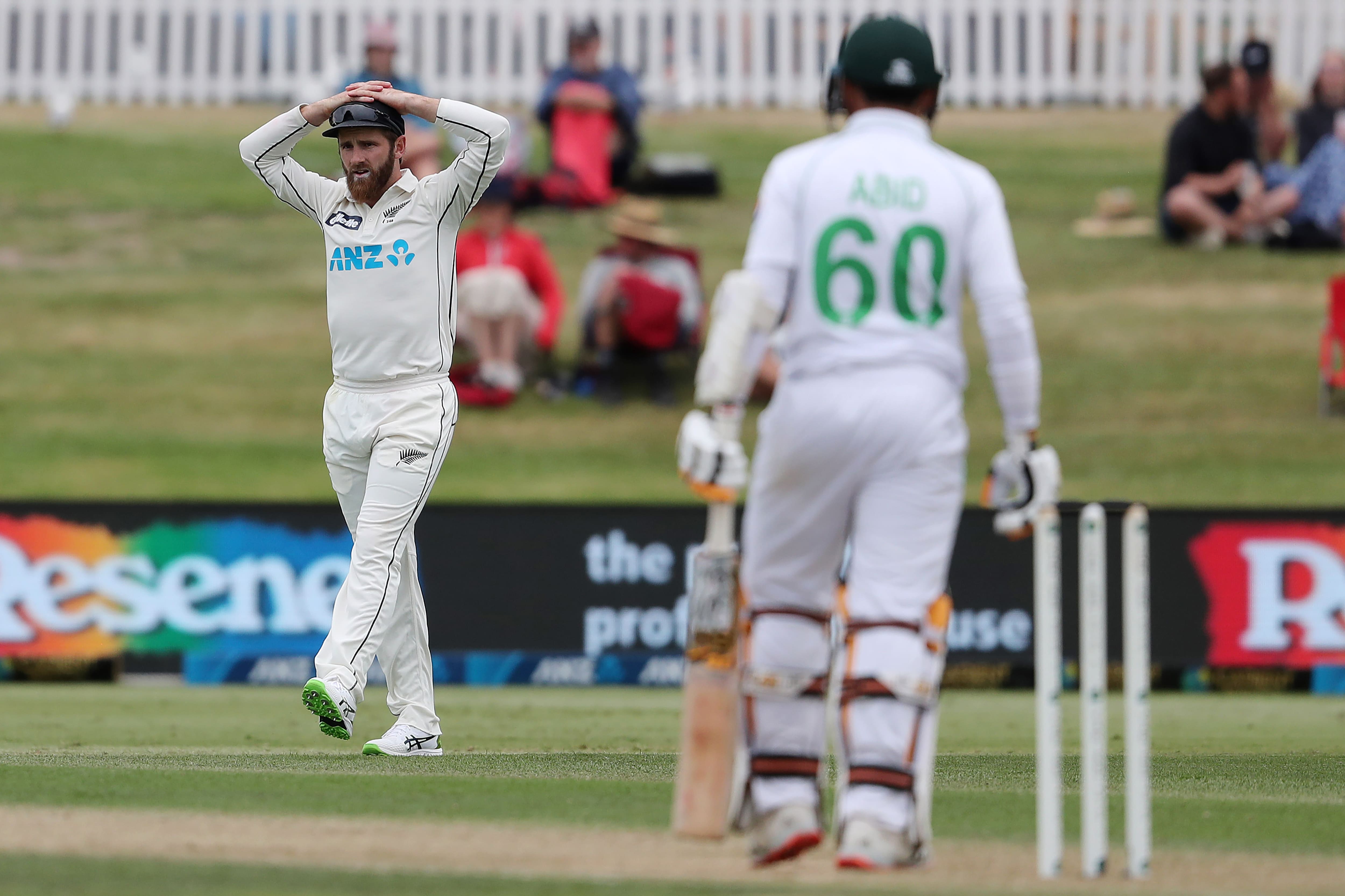 New Zealand’s captain Kane Williamson (L) reacts during the second day of the first cricket Test match between New Zealand and Pakistan at the Bay Oval in Mount Maunganui on December 27, 2020. (AFP)