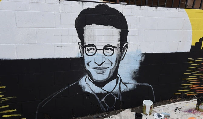 This file photo shows partially completed portrait by artist Levi Ponce for his Memorial Day mural project of slain journalist Daniel Pearl, near his old neigborhood in Los Angeles, California on May 23, 2015. (AFP)