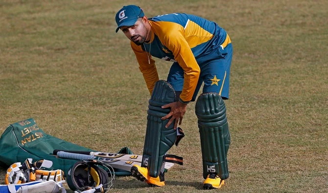 Pakistan cricket team skipper Babar Azam pads up during a practice session at the Pindi Cricket Stadium, in Rawalpindi on Oct. 29, 2020. (AP)