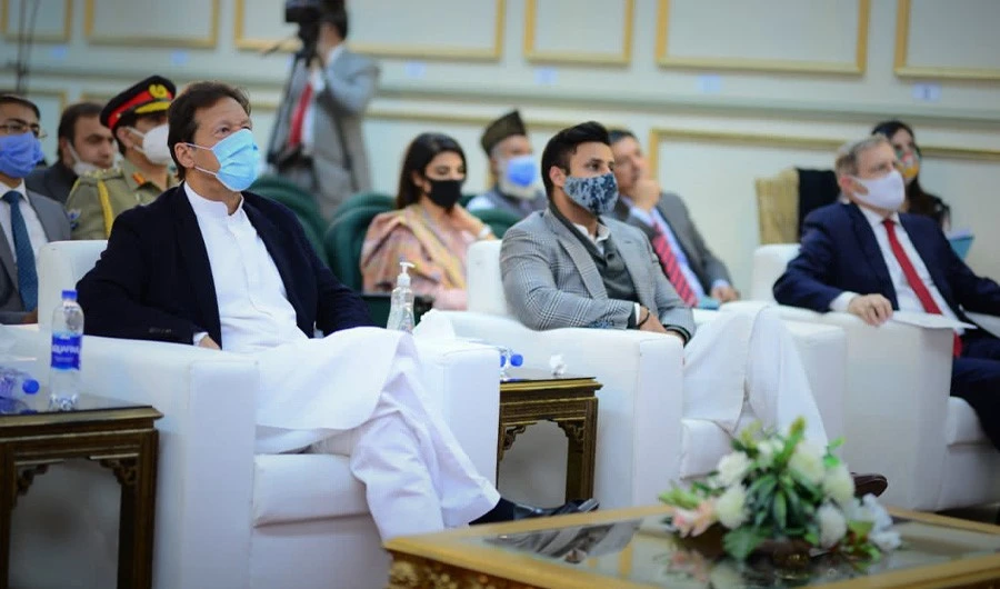 In this photo taken on December 12, 2020, Prime Minister Imran Khan and special adviser to PM on overseas Pakistanis Sayed Zulfiqar Bukhari attended the launching ceremony of Travel Responsibly for Experiencing Ecotourism in Khyber Pakhtunkhwa. (Photo Courtesy: Pakistan's PM Office)