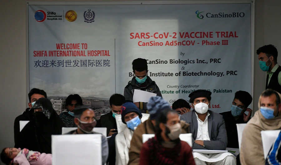 FILE - In this picture taken on November 25, 2020 volunteers wait to be administered the new Chinese-made vaccine for the Covid-19 coronavirus, the first ever Phase 3 clinical trial for any vaccine in Pakistan, at a hospital in Islamabad. (AFP)