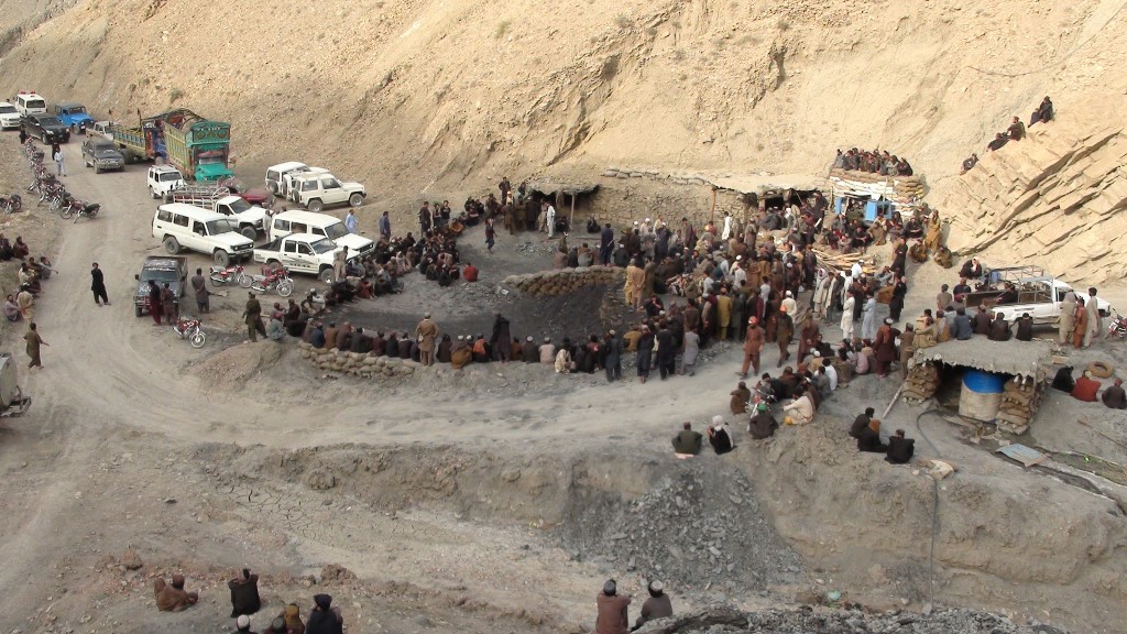 In this file photo, Pakistani miners gather outside a mine in Marwaarh area, 45 kilometers east of Quetta, the capital of oil and gas-rich Balochistan province on May 5, 2018. (AFP)