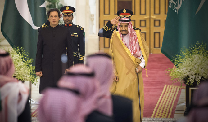 In this handout photograph released by Pakistan’s Press Information Department (PID) on October 23, 2018, Saudi King Salman meets with Prime Minister Imran Khan in Riyadh, Saudi Arabia. (AFP)