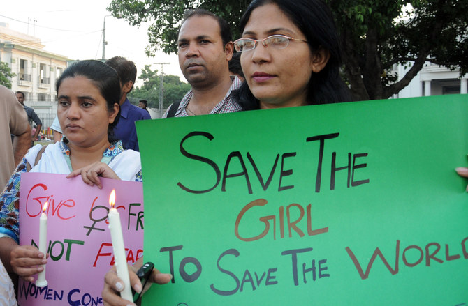 In this file photo, Pakistani NGOs workers carry placards during a protest against the rape of a five year old girl, in Lahore on September 19, 2013. (File/ AFP)