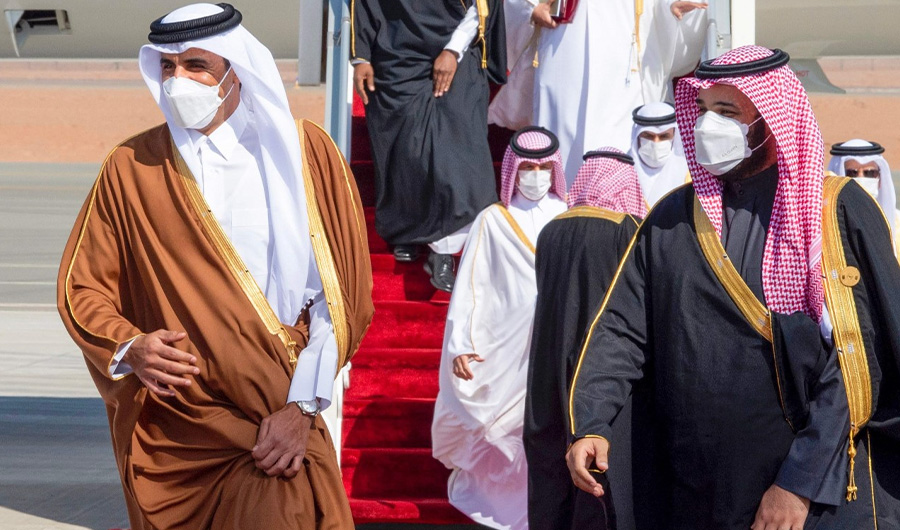 A handout picture provided by the Saudi Royal Palace on January 5, 2021, shows Crown Prince Mohammed bin Salman (R) welcoming Emir of Qatar Tamim bin Hamad Al-Thani (L) upon his arrival in the city of al-Ula in northwestern Saudi Arabia for the 41st Gulf Cooperation Council (GCC) summit. (AFP)