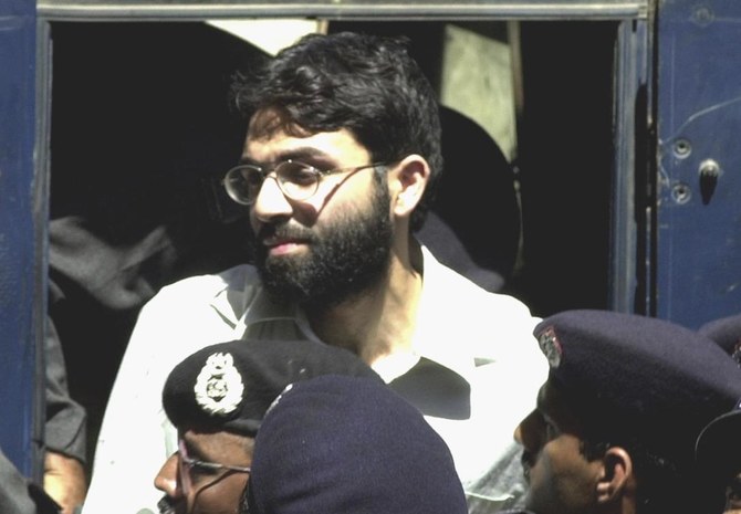 Ahmed Omar Saeed Sheikh arrives at a court in Karachi, Pakistan, March 29, 2002. (AP Photo)