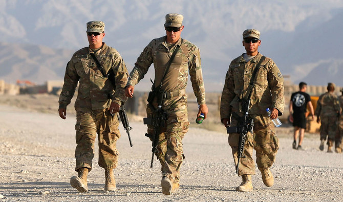 In this file photo, US troops walk at their base in Logar province, Afghanistan on Aug. 4, 2018. Taliban on Saturday denied US media reports saying that a Russian intelligence unit secretly rewarded them for targeting American troops in Afghanistan. (REUTERS)