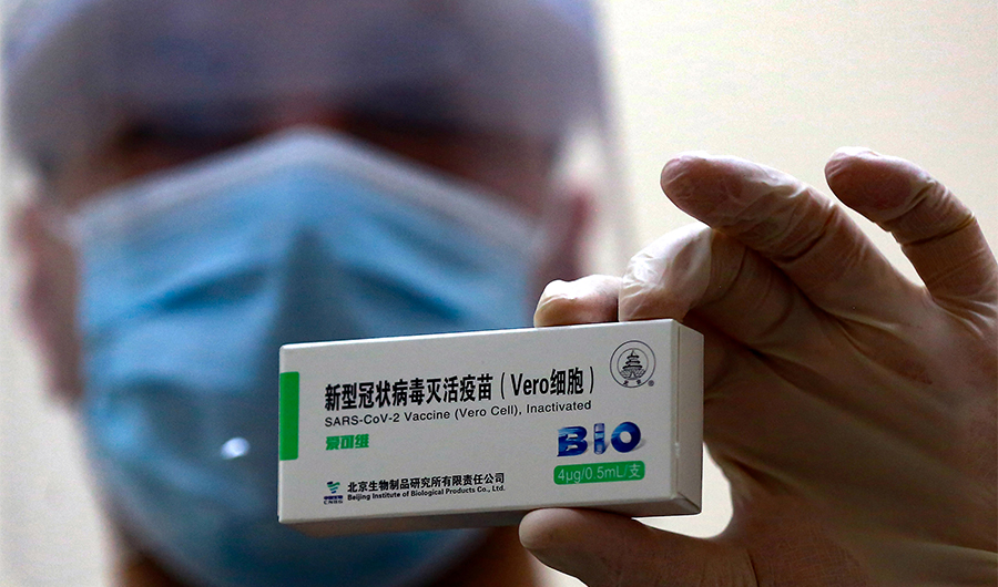A health worker shows a dose of the Chinese Sinopharm vaccine against the coronavirus COVID-19 disease, at a vaccination centre in the Jordanian capital Amman, on January 13, 2021. (AFP)