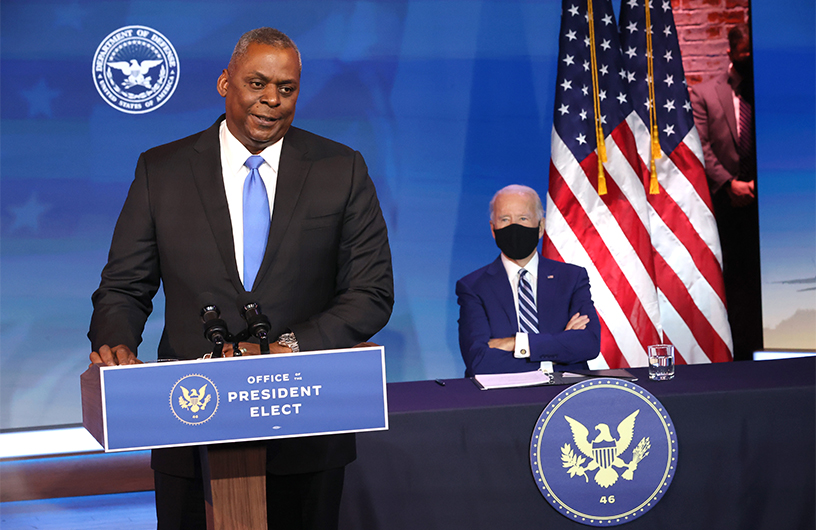 U.S. Army (retired) General Lloyd Austin (L) speaks after being formally nominated to be Secretary of the Department of Defense by U.S. President-elect Joe Biden at the Queen Theatre on December 09, 2020 in Wilmington, Delaware. (AFP)