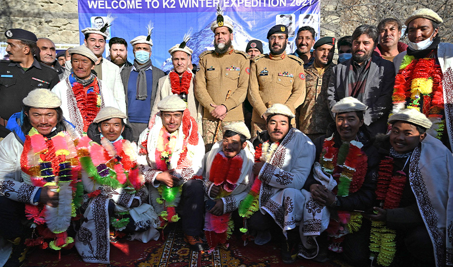 Nepal's climbers pose a photograph with Pakistani officials while attend a welcome ceremony upon their arrival after becoming the first to summit Pakistan's K2 in winter, at Shigar district in the Gilgit-Baltistan region of northern Pakistan on January 20, 2021. (AFP)