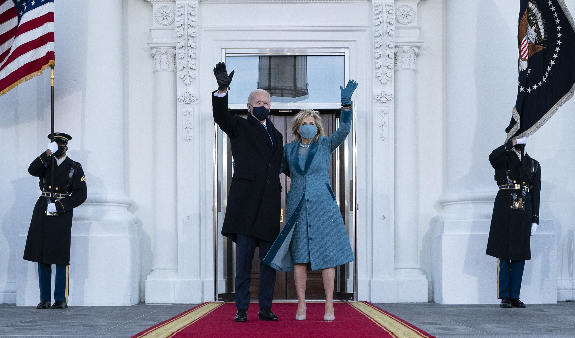 US President Joe Biden and First Lady Jill Biden wave as they arrive at the White House in Washington DC, on Jan. 20, 2021. (AFP)