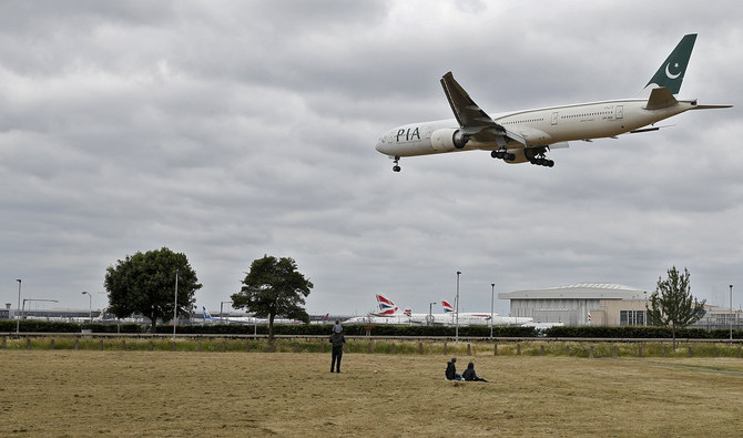 A Pakistan International Airlines Boeing 777 comes in to land at Heathrow airport in west London on June 8, 2020. (AFP)