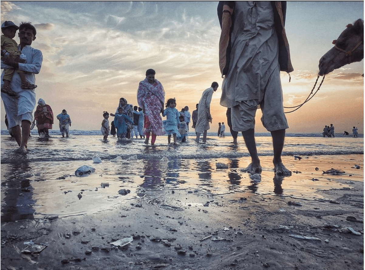 This image shared by Khaula Jamil on June 6, 2020, shows people walking on the beach in Karachi. (Photo courtesy: Khaula Jamil)