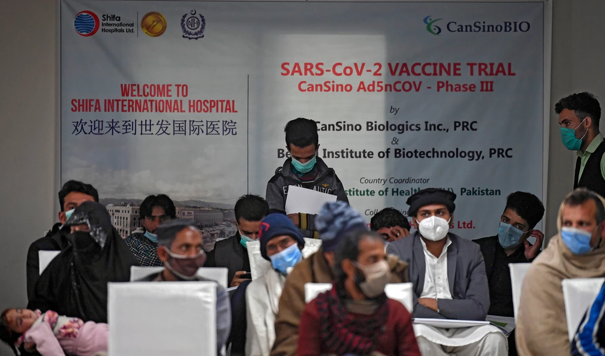In this picture taken on November 25, 2020 volunteers wait to be administered the new Chinese-made vaccine for the Covid-19 coronavirus, the first ever Phase 3 clinical trial for any vaccine in Pakistan, at a hospital in Islamabad. (AFP/File)