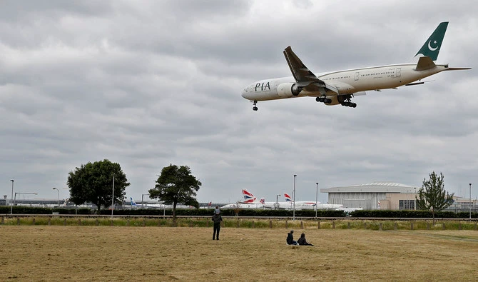 A Pakistan International Airlines Boeing 777 comes in to land at Heathrow airport in west London on June 8, 2020. (AFP)