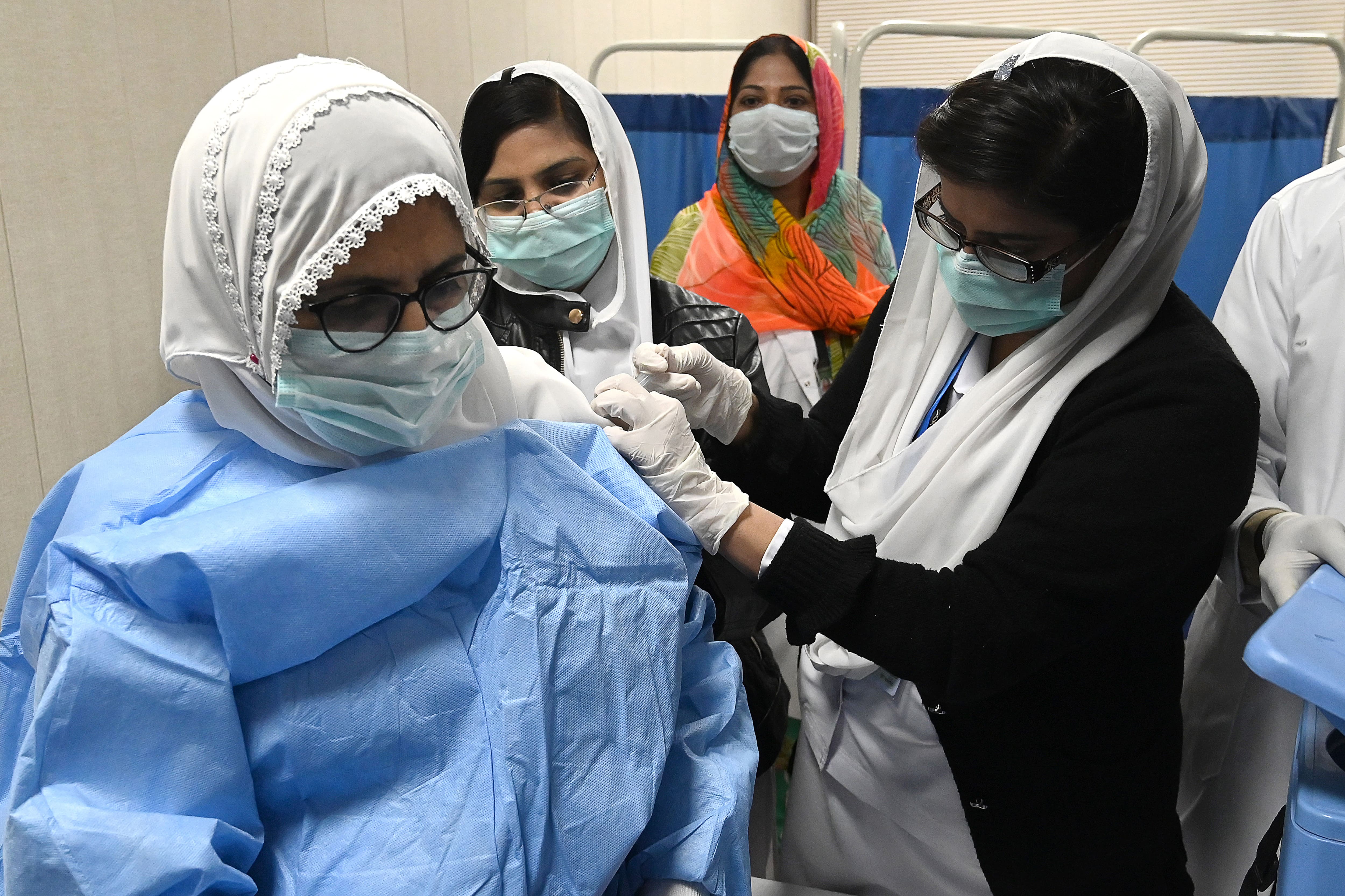 A doctor receives a dose of the Chinese-made Sinopharm Covid-19 vaccine, at a vaccination centre in Lahore on February 3, 2021. (AFP)
