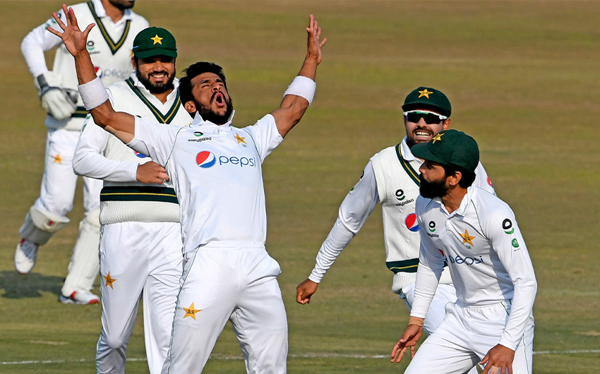 Pakistan's Hasan Ali (C) celebrates with teammates after taking the wicket of South Africa's Rassie van der Dussen (not pictured) during the second day of the second Test cricket match between Pakistan and South Africa at the Rawalpindi Cricket Stadium in Rawalpindi on February 5, 2021. (AFP/File)