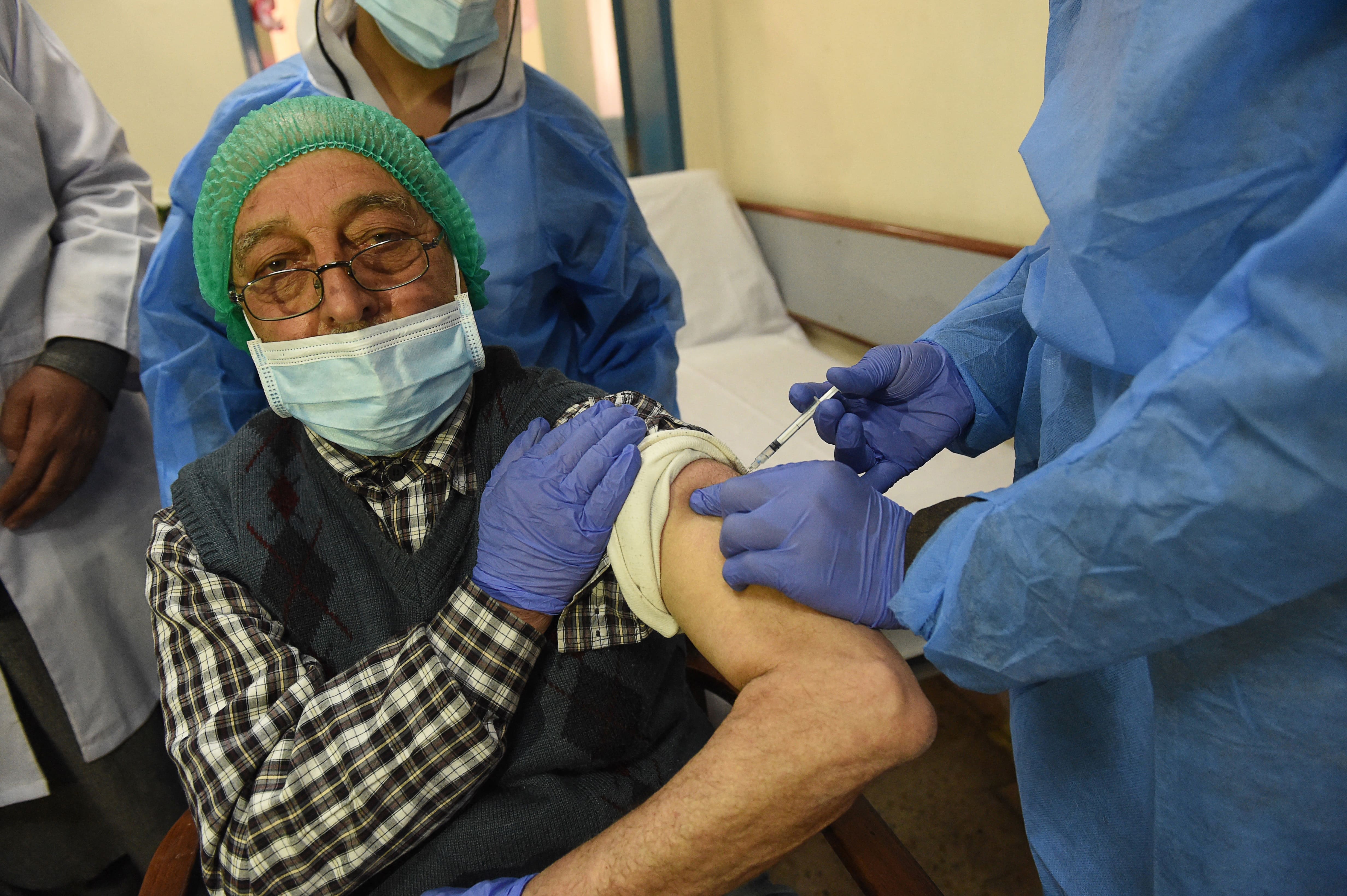 A doctor receives a dose of the Chinese-made Sinopharm Covid-19 vaccine, at a vaccination centre in Quetta on February 3, 2021. (AFP)