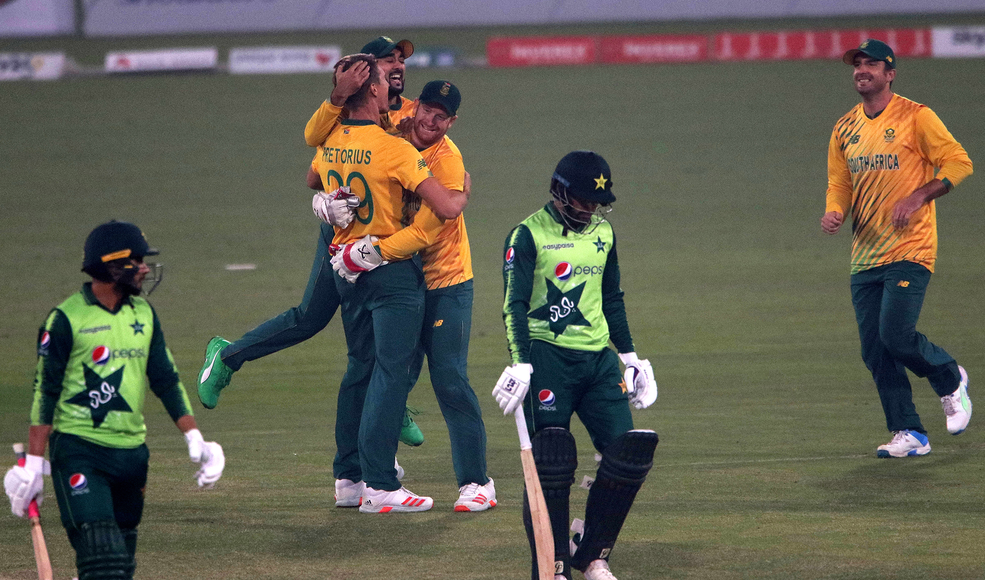 South African cricketers celebrates after taking the wicket of Pakistani cricketers Muhammad Nawaz during the second T20 cricket match between Pakistan and South Africa in Lahore, Pakistan, 13 February 2021. (EPA)
