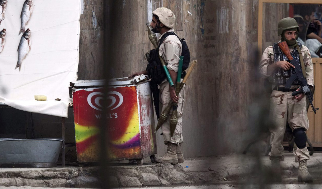 Afghan counter-terrorism personnel keep watch near the building, which the Taliban insurgents took over during an attack near the US embassy, in Kabul, Afghanistan on September 13, 2011. (REUTERS/File)